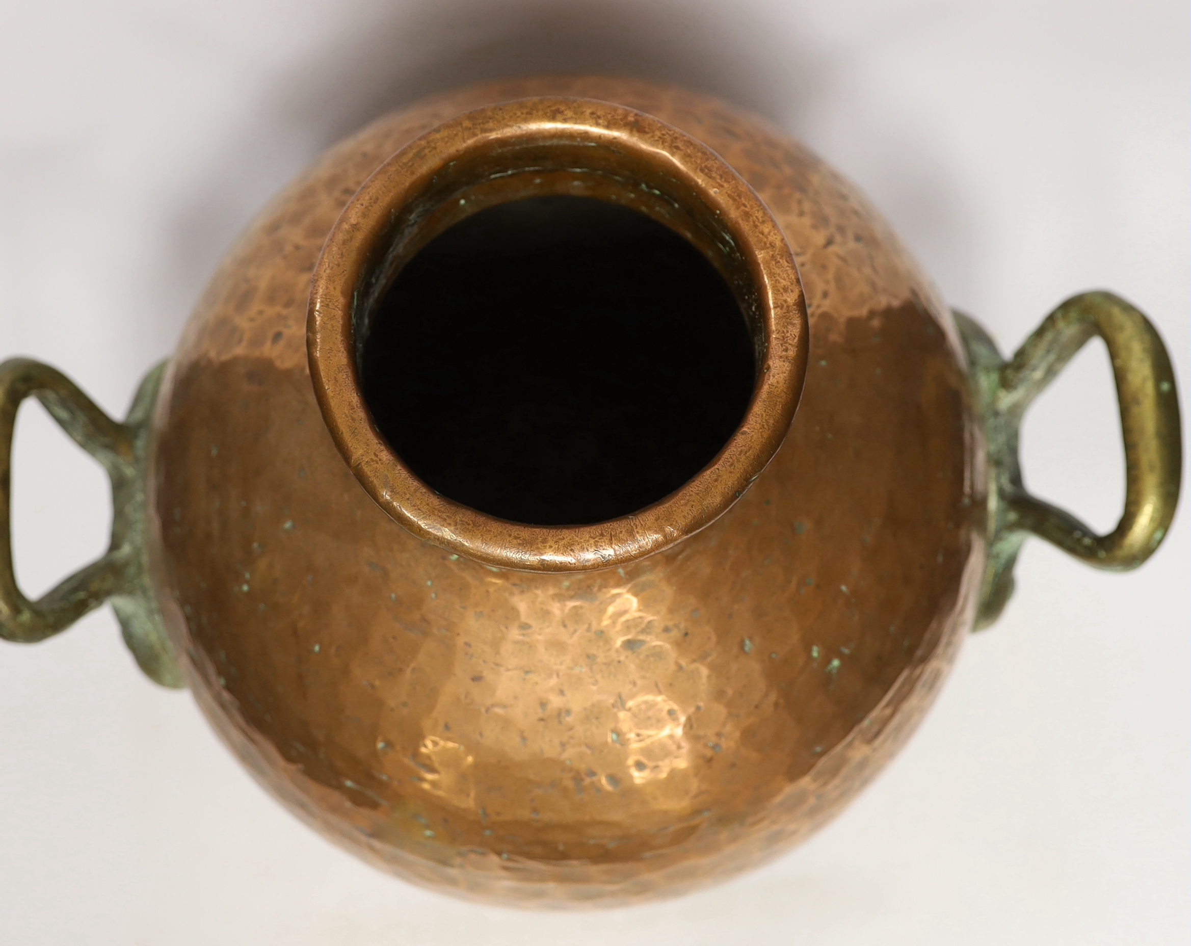 A copper vessel with double brass handles, 39cm high